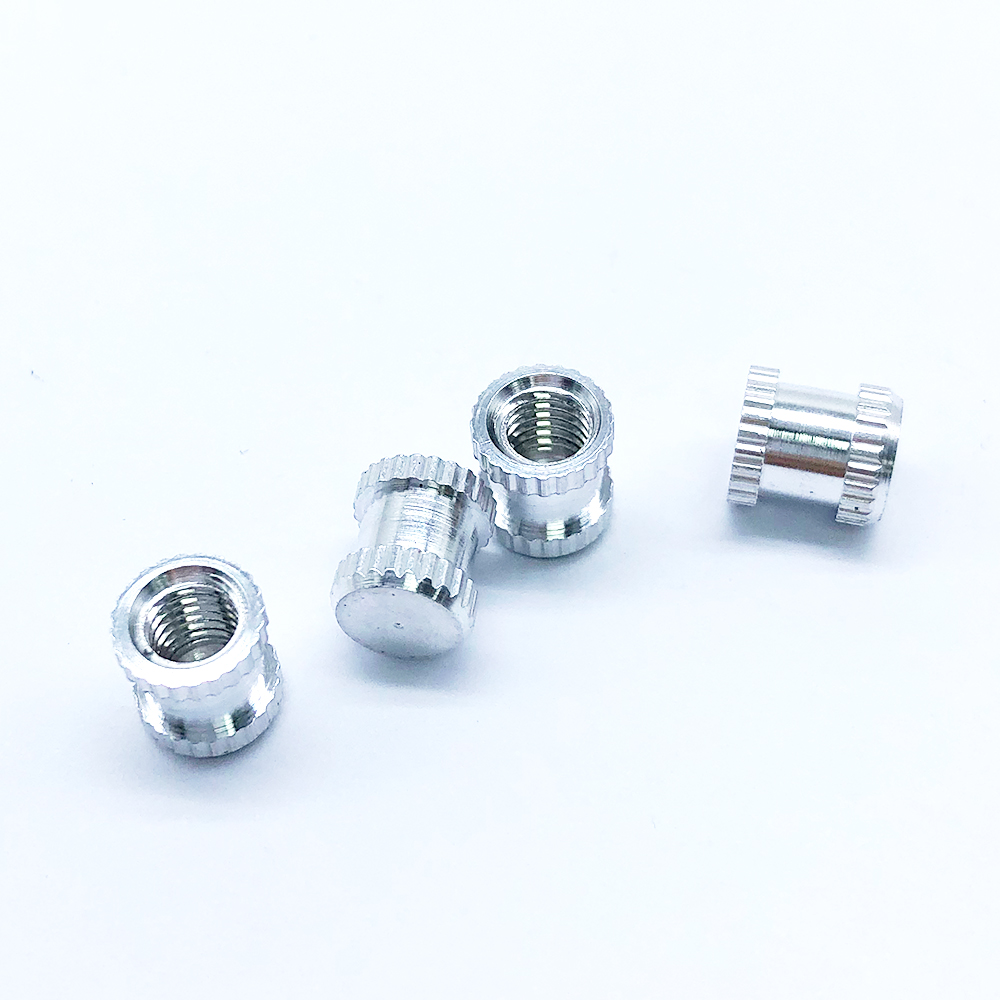Embedded Nut with Embossed Inlay
