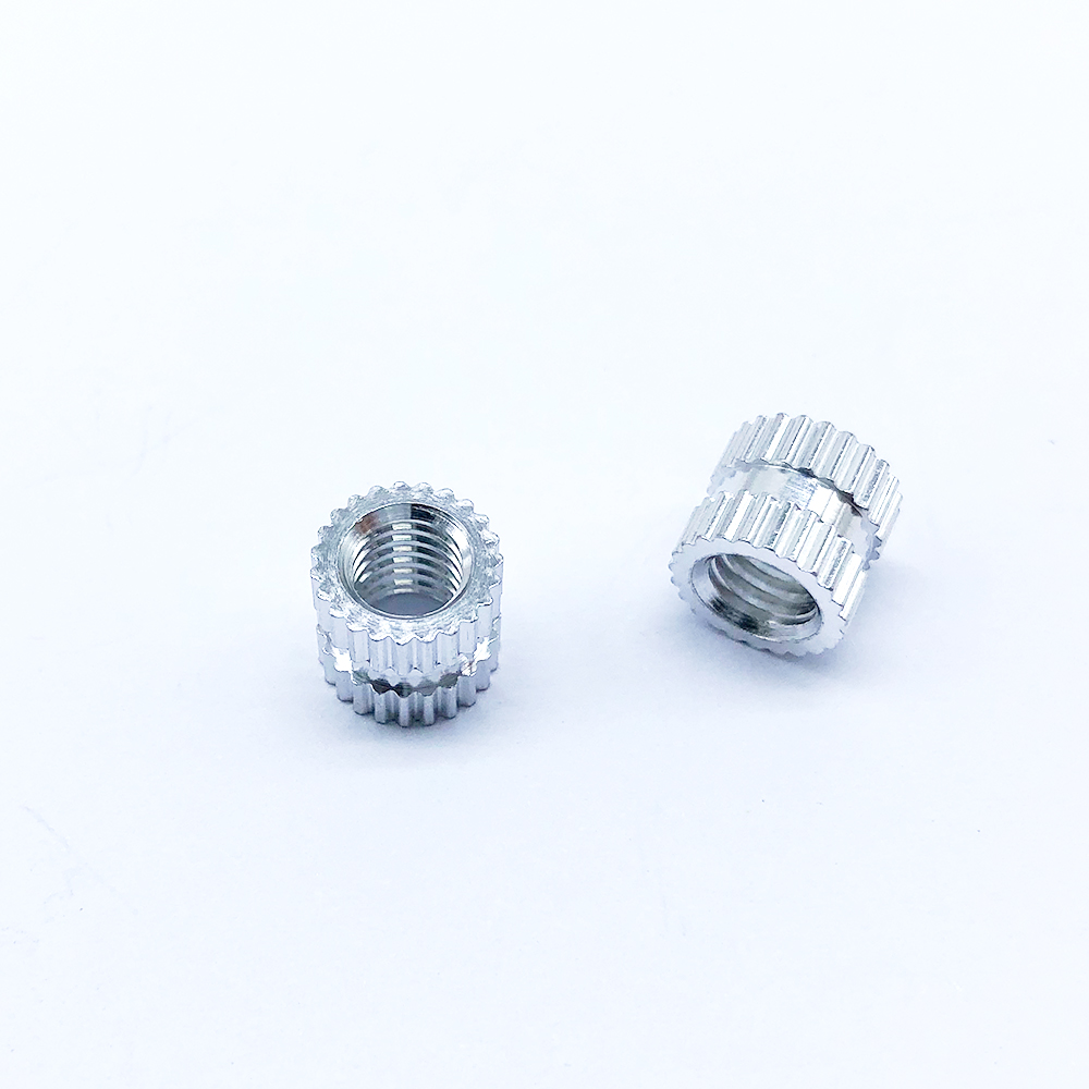 Embedded Nut with Embossed Inlay